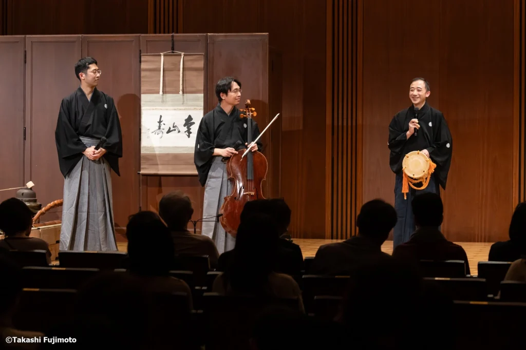 The three performers speaking on stage after the performance.