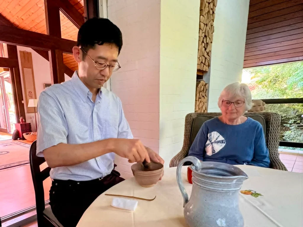 Preparing matcha in a tea bowl made by Gudrun Paysen.